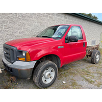 driver's side of red Ford truck