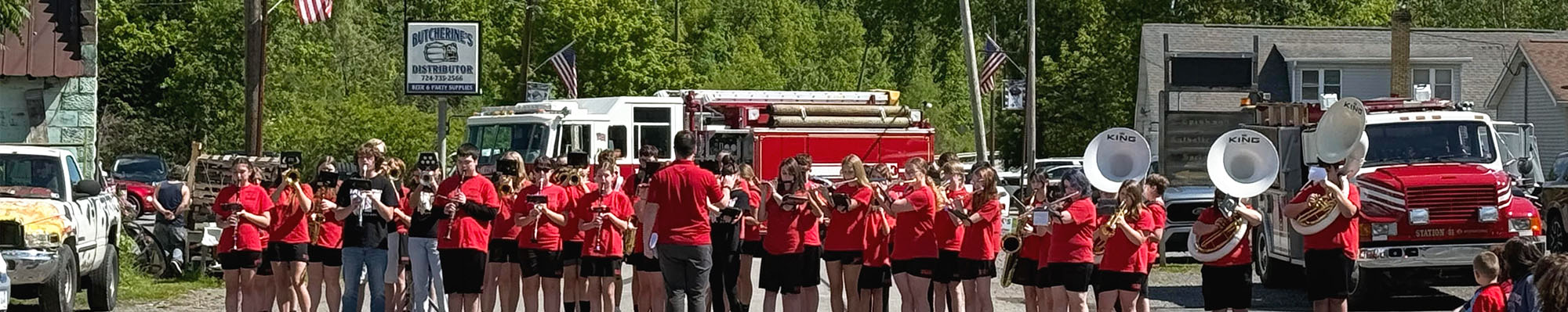 Memorial Day gathering of students playing instruments outside