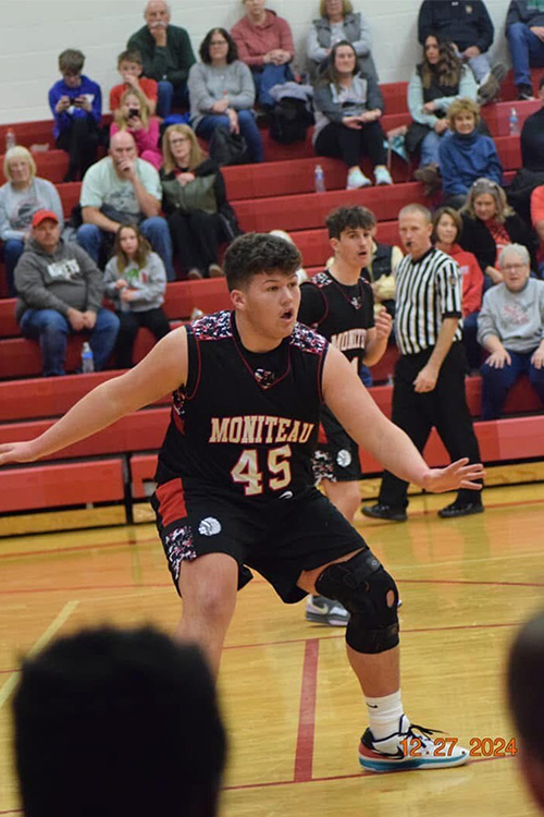 male basketball player dribbling