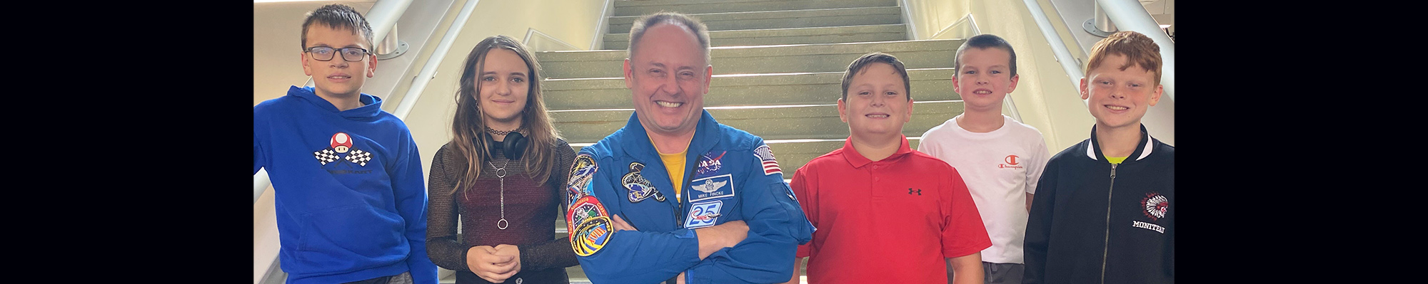 Mike Fincke, American astronaut, posing for a picture with students