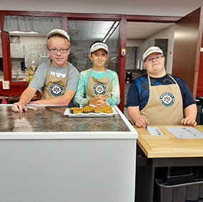 Three students working in the Coffee Cafe