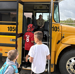 Students getting on the school bus