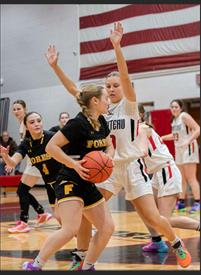 player blocking another player with the basketball