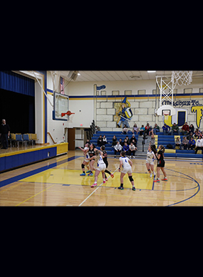 Girls basketball game on the court