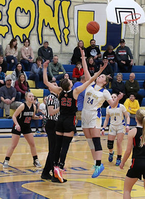 Players reaching for the ball during a game