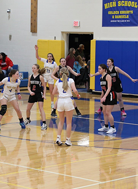 Girls basketball game in action