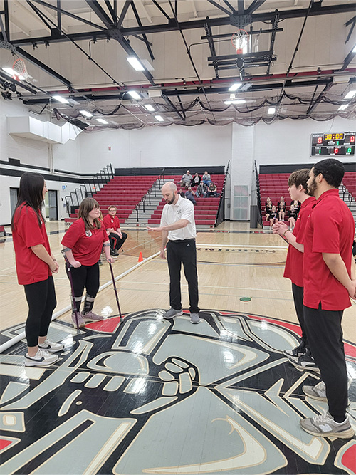 Coach talking to the team