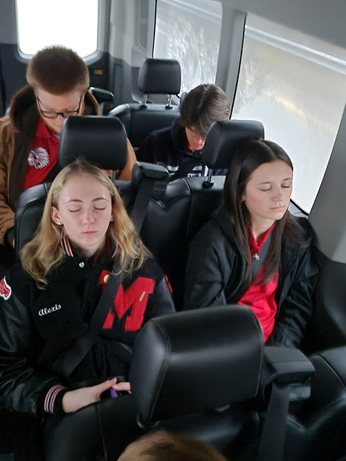 Bocce ball team on a bus resting
