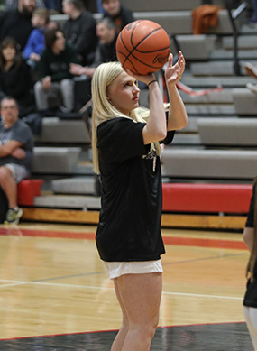 Abby preparing to make a shot during a basketball game